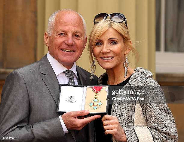 Co-founder of Stonewall and former EastEnders actor, Michael Cashman with friend and actress, Michelle Collins after he received his Commander of the...