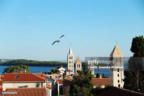four bell towers of rab town;croatia - bell tower tower stock pictures, royalty-free photos & images