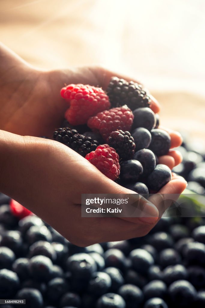 Hand holding berries