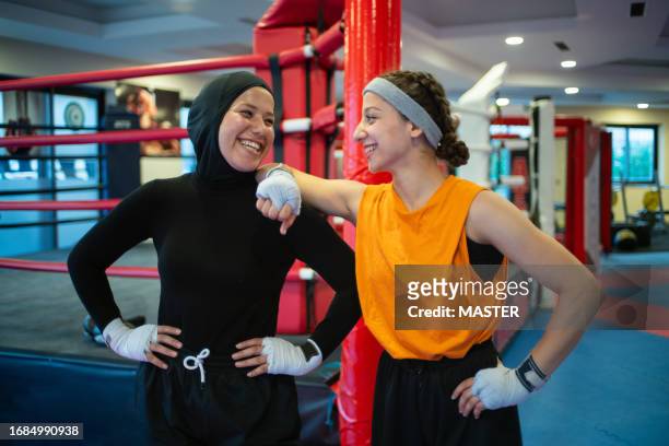 middle eastern females boxing in gym - arab woman studio stock pictures, royalty-free photos & images