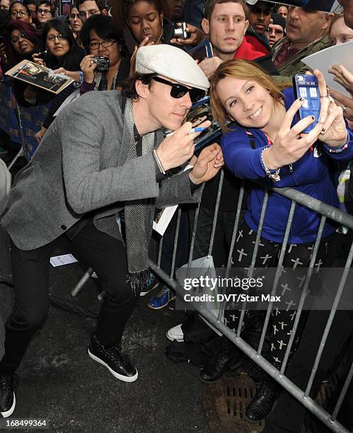 Benedict Cumberbatch poses with a fan seen on May 9, 2013 in New York City.