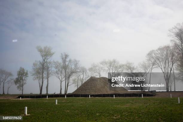 Landscape views, seen through the window of a bus shuttling family members to the grave site of relatives, of Hart Island, New York Citys burial...