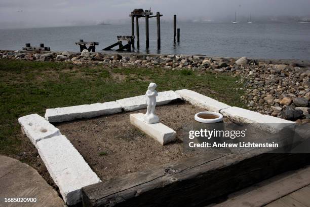 Landscape views of Hart Island, New York Citys burial grounds for the poor, unknown, and unclaimed. April 16 as seen from City Island in the Bronx,...