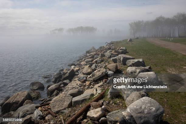 Landscape views of Hart Island, New York Citys burial grounds for the poor, unknown, and unclaimed. April 16 as seen from City Island in the Bronx,...