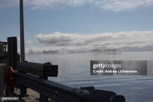 Landscape views across Long Island Sound at Hart Island, New York Citys burial grounds for the poor, unknown, and unclaimed. April 16 as seen from...