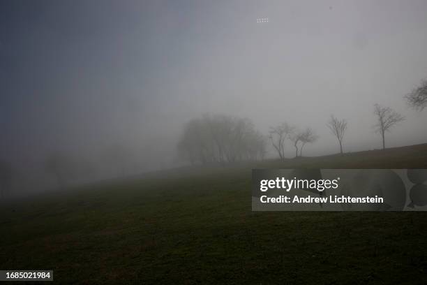 Landscape views, seen through the window of a bus shuttling family members to the grave site of relatives, of Hart Island, New York Citys burial...