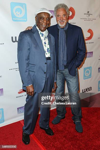 Musician Buddy Guy and singer Tom Jones arrive at the NARM Music Biz Awards dinner party at the Hyatt Regency Century Plaza on May 9, 2013 in Century...