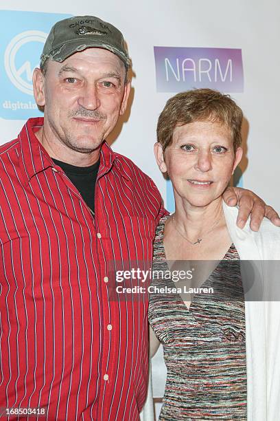 Personality Troy Landry and wife Bernita Landry arrive at the NARM Music Biz Awards dinner party at the Hyatt Regency Century Plaza on May 9, 2013 in...