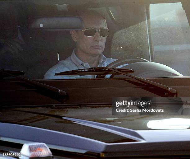 Russian President Vladimir Putin during a visit to the Olympic Stadium on May 10, 2013 in Sochi, Russia. David Cameron is on a one-day visit to...