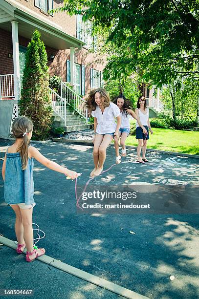 Jumping rope in the driveway.
