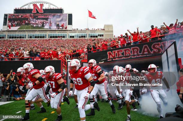 The Nebraska Cornhuskers take the field before the game against the Louisiana Tech Bulldogs at Memorial Stadium on September 23, 2023 in Lincoln,...