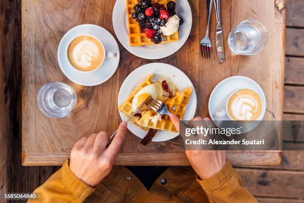 eating waffles at the cafe for breakfast, personal perspective view - waffled stock pictures, royalty-free photos & images