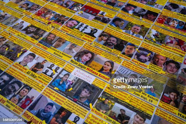 Portraits on the ground of people who are detained and at risk of execution in Iran because of the protests on September 16, 2023 in Barcelona,...