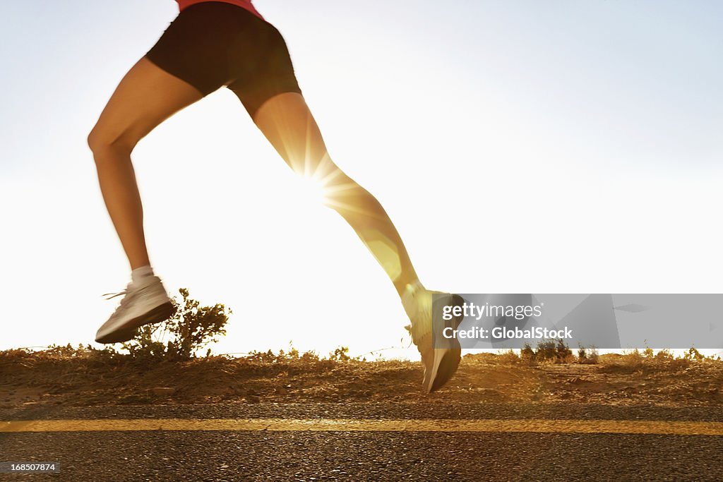 Active woman running in the countryside