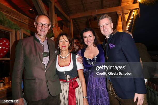 Friedrich Merz, Charlotte Merz, Dorothee Baer, Oliever Baer during the 188th Oktoberfest at Käferzelt on September 23, 2023 in Munich, Germany.