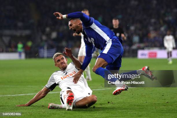 Karlan Grant of Cardiff City reacts after being tackled by Nathan Wood of Swansea City during the Sky Bet Championship match between Cardiff City and...