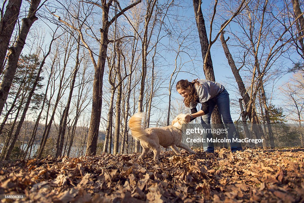 Woman playing with pet dog