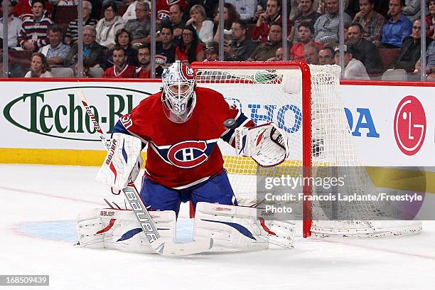 Peter Budaj of the Montreal Canadiens keeps track of a shot from the Ottawa Senators in Game Five of the Eastern Conference Quarterfinals during the...