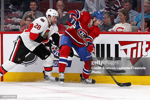 Jarred Tinordi of the Montreal Canadiens controls the puck against Matt Kassian of the Ottawa Senators in Game Five of the Eastern Conference...