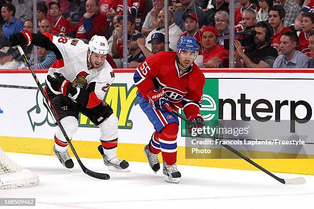 Francis Bouillon of the Montreal Canadiens skates against Matt Kassian of the Ottawa Senators in Game Five of the Eastern Conference Quarterfinals...