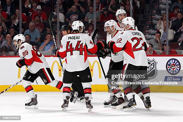 Cory Conacher of the Ottawa Senators celebrates his goal with teammates Jean-Gabriel Pageau, Erik Condra, Sergei Gonchar and Jared Cowen against the...