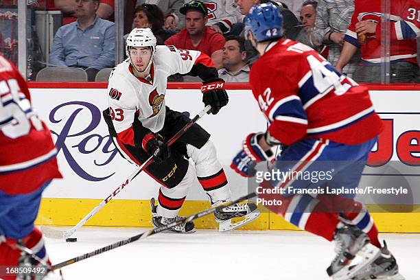 Mika Zibanejad of the Ottawa Senators skates with the puck against Jarred Tinordi of the Montreal Canadiens in Game Five of the Eastern Conference...