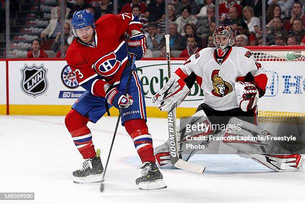 Craig Anderson of the Ottawa Senators defends against Michael Ryder of the Montreal Canadiens in Game Five of the Eastern Conference Quarterfinals...