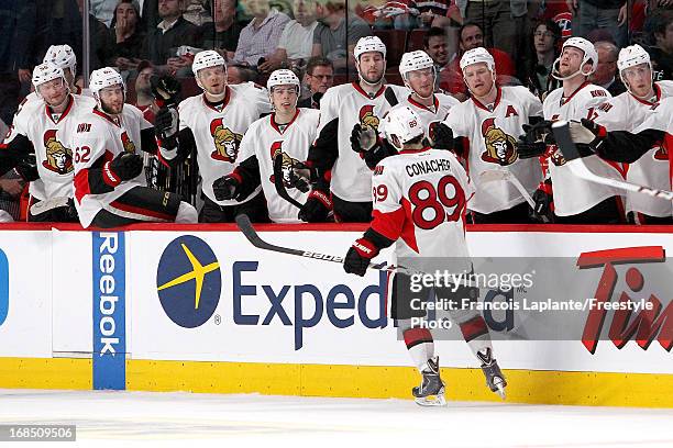 Cory Conacher of the Ottawa Senators celebrates a goal at the bench with teammates against the Montreal Canadiens in Game Five of the Eastern...