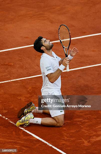 Pablo Andujar from Spain celebrates matchpoint over Kei Nishikori of Japan on day seven of the Mutua Madrid Open tennis tournament at the Caja Magica...