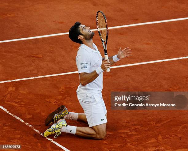 Pablo Andujar from Spain celebrates matchpoint over Kei Nishikori of Japan on day seven of the Mutua Madrid Open tennis tournament at the Caja Magica...