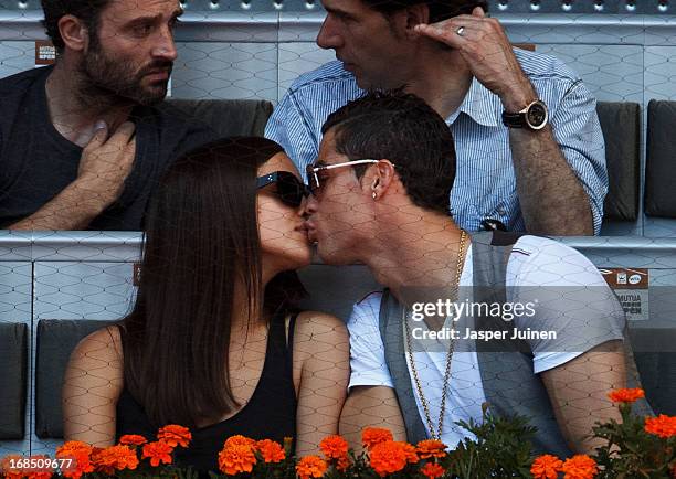 Real Madrid player Cristiano Ronaldo kisses his girlfriend Irina Shayk during the match between Rafael Nadal and David Ferrer of Spain on day seven...