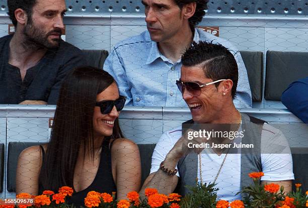 Real Madrid player Cristiano Ronaldo cuddles with his girlfriend Irina Shayk during the match between Rafael Nadal and David Ferrer of Spain on day...