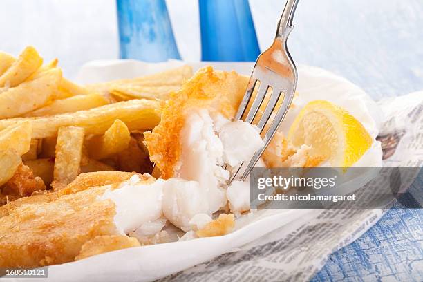 fish and chips in newspaper - fillet stock pictures, royalty-free photos & images