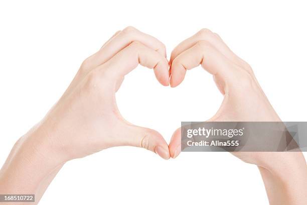 love: hands making a heat shape on white - heart cross section stock pictures, royalty-free photos & images