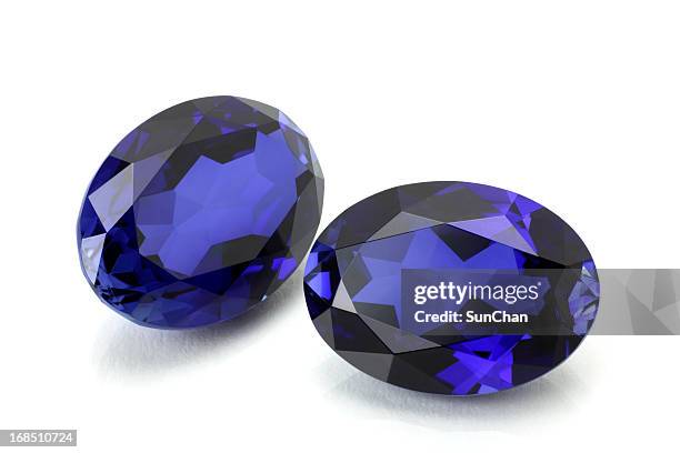 pair of sapphire or tanzanite. - sapphire stone stock pictures, royalty-free photos & images