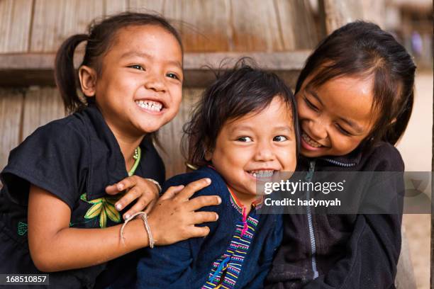 three little girls in northern laos - indigenous culture stock pictures, royalty-free photos & images