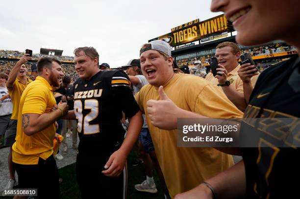 Place kicker Harrison Mevis of the Missouri Tigers Celebrates with fans after kicking the game-winning field goal against the Kansas State Wildcats...