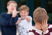 Elementary Student Hides His Face While Being Bullied