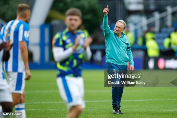 Neil Warnock the manager of Huddersfield Town gestures to the fans at full time during the Sky Bet Championship match between Huddersfield Town and...