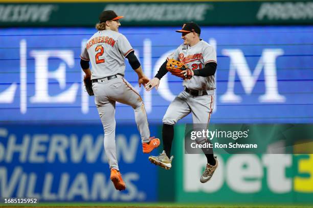 Gunnar Henderson and Austin Hays of the Baltimore Orioles celebrate a 2-1 win against the Cleveland Guardians at Progressive Field on September 23,...