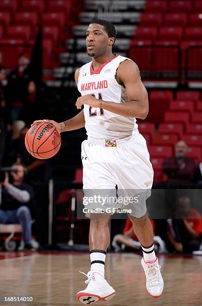 Pe'Shon Howard of the Maryland Terrapins handles the ball during the first round of the NIT Basketball Tournament against the Niagara Purple Eagles...