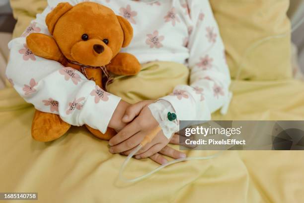 little patient in pediatric ward - stuffed toy stock pictures, royalty-free photos & images
