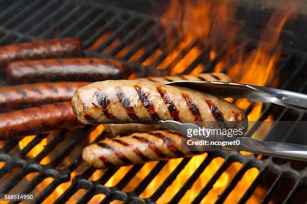grilling brats - sausage stock pictures, royalty-free photos & images