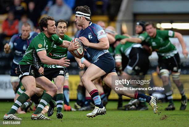 Mark Atkinson of Bedford Blues is tackled by Rupert Cooper of Nottingham Rugby during the RFU Championship Play Off Semi Final Second Leg match...