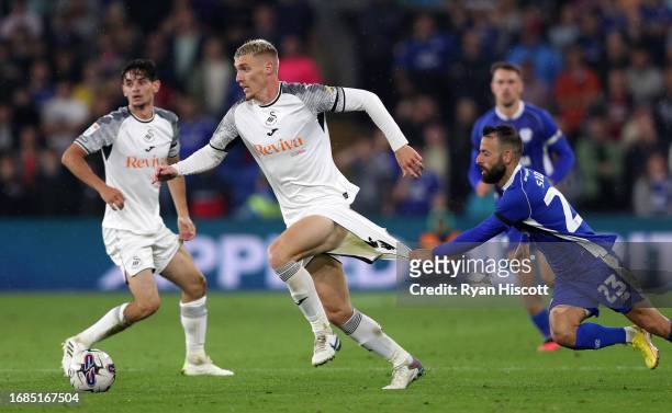 Jay Fulton of Swansea City on the ball whilst under pressure from Manolis Siopis of Cardiff City during the Sky Bet Championship match between...