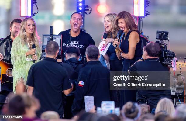 Singer-songwriter Carrie Underwood, a fan, Jenna Bush Hager and Hoda Kotb are seen on stage during NBC's "Today" show Citi Concert Series at...