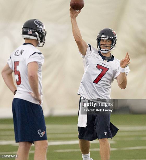 Quarterback Case Keenum of the Houston Texans throws a pass as Collin Klein looks on during Houston Texans Rookie Mini Camp on May 10, 2013 in...