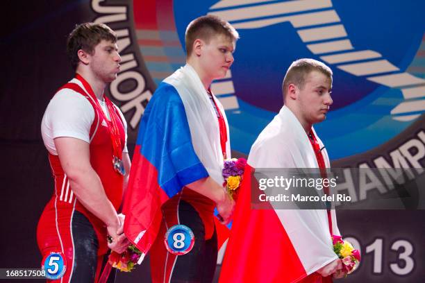 Podium of Men's 105kg Total during day seven of the 2013 Junior Weightlifting World Championship at Maria Angola Convention Center on May 10, 2013 in...