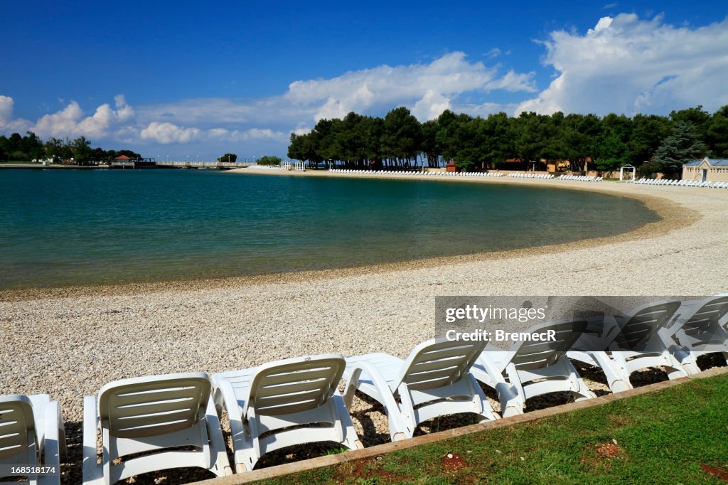 Empty off-season beach on sunny spring day