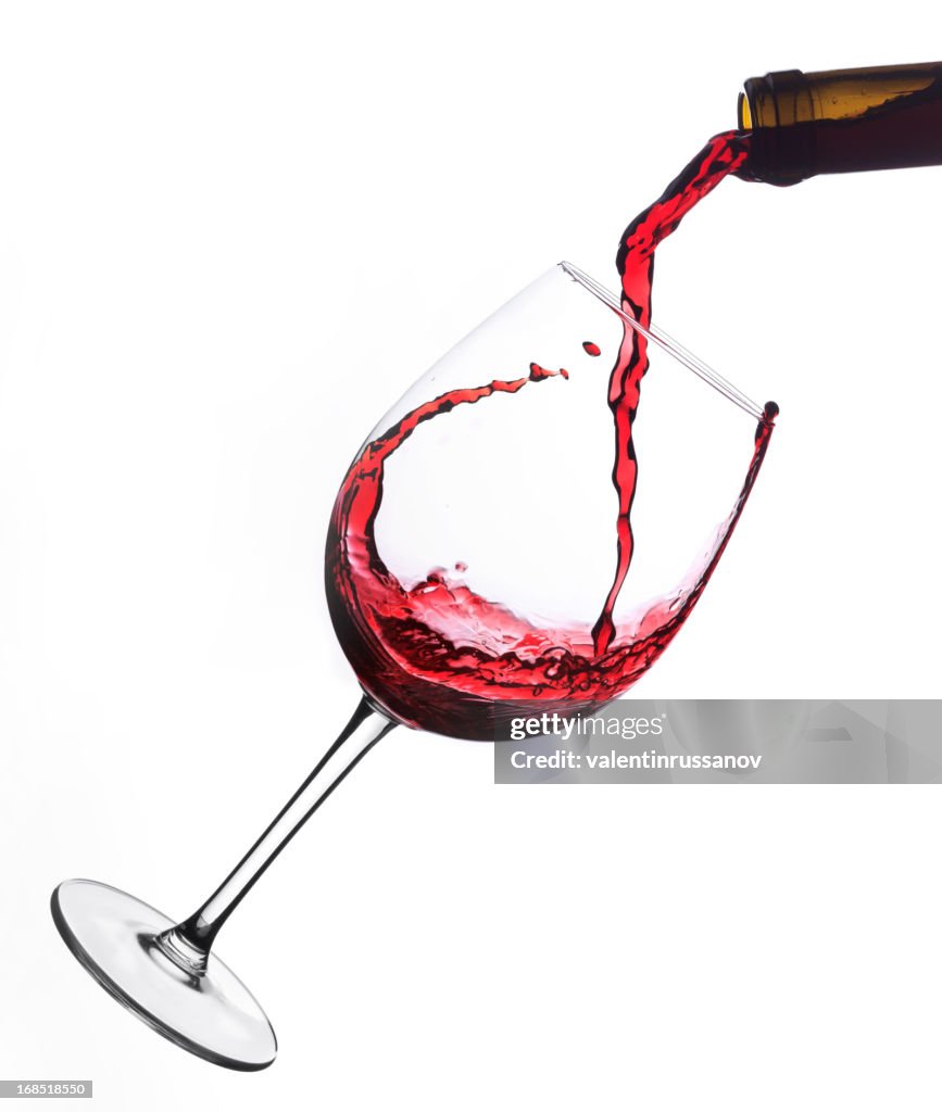 Red wine poured into glas
